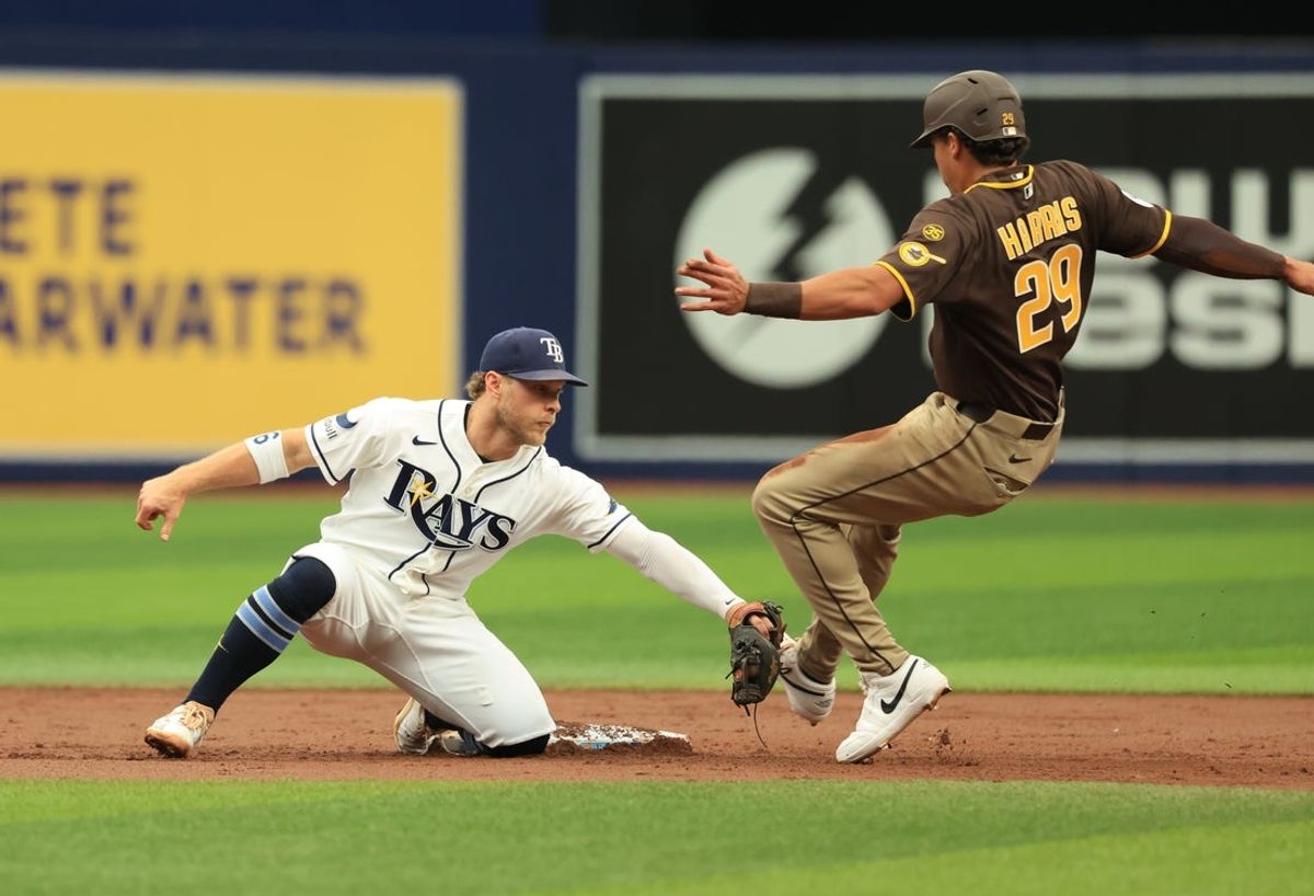 Aug 30, 2026; St. Petersburg, Florida, USA;  Tampa Bay Rays shortstop Taylor Walls (6) tags out San Diego Padres left fielder Dustin Harris (29) during the second inning at Tropicana Field.  Mandatory Credit: Kim Klement Neitzel-Imagn Images