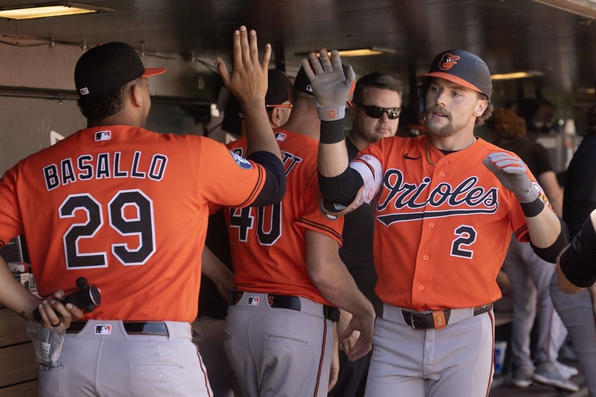 Aug 30, 2026; West Sacramento, California, USA;  Baltimore Orioles shortstop Gunnar Henderson (2) gets high fives from his teammates after hitting a solo home run against the Athletics during the first inning at Sutter Health Park.  Mandatory Credit: D. Ross Cameron-Imagn Images