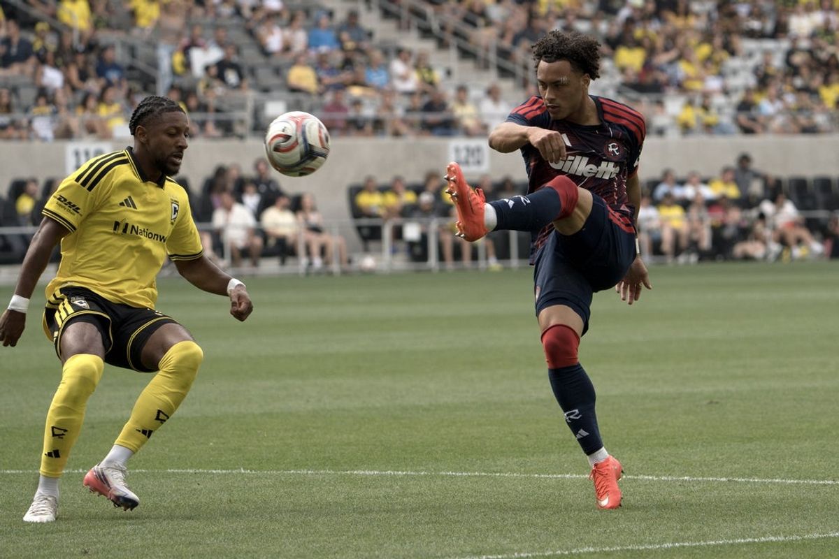 Aug 29, 2026; Columbus, Ohio, USA;  New England Revolution defender Peyton Miller (25) plays the ball defended by Columbus Crew defender Steven Moreira (31) during the first half at ScottsMiracle-Gro Field.  Mandatory Credit: Barbara Perenic-Imagn Images