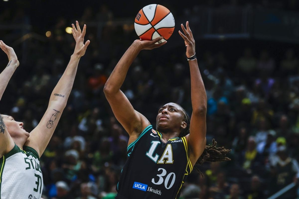 Aug 30, 2026; Seattle, Washington, USA; Los Angeles Sparks forward Nneka Ogwumike (30) shoots against Seattle Storm center Stefanie Dolson (31) during the first quarter at Climate Pledge Arena. Mandatory Credit: Joe Nicholson-Imagn Images