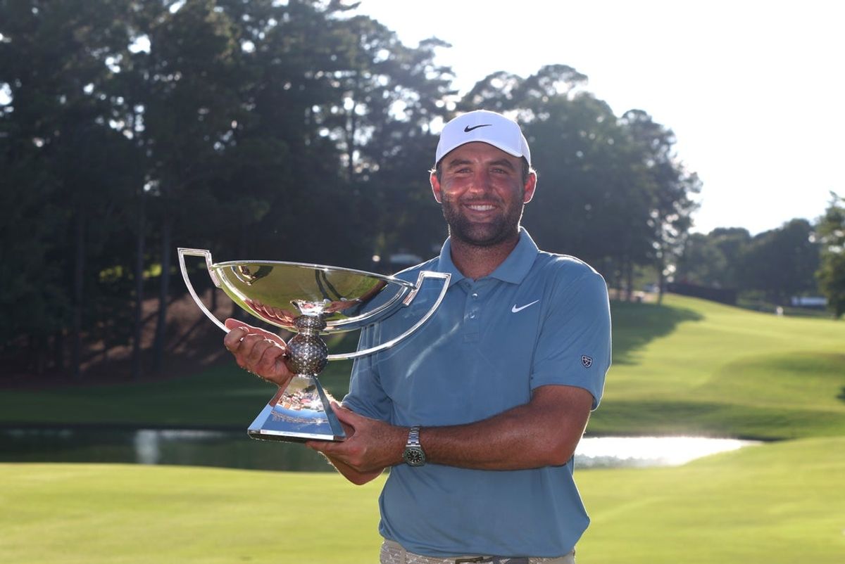 Aug 30, 2026; Atlanta, Georgia, USA;  Scottie Scheffler  poses with the trophy after winning the final round of the TOUR Championship golf tournament.  Mandatory Credit: Brett Davis-Imagn Images