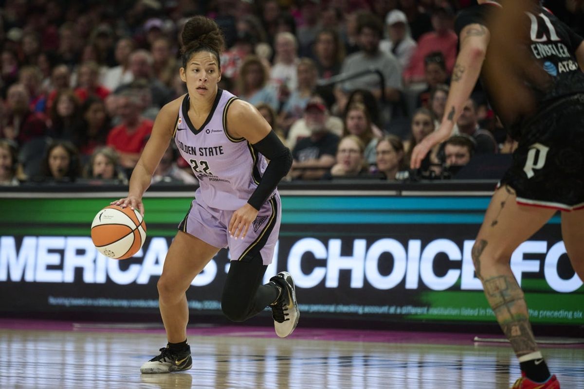 Aug 30, 2026; Portland, Oregon, USA; Golden State Valkyries guard Veronica Burton (22) dribbles the ball during the first half against Portland Fire forward Emily Engstler (21) at Moda Center. Mandatory Credit: Troy Wayrynen-Imagn Images