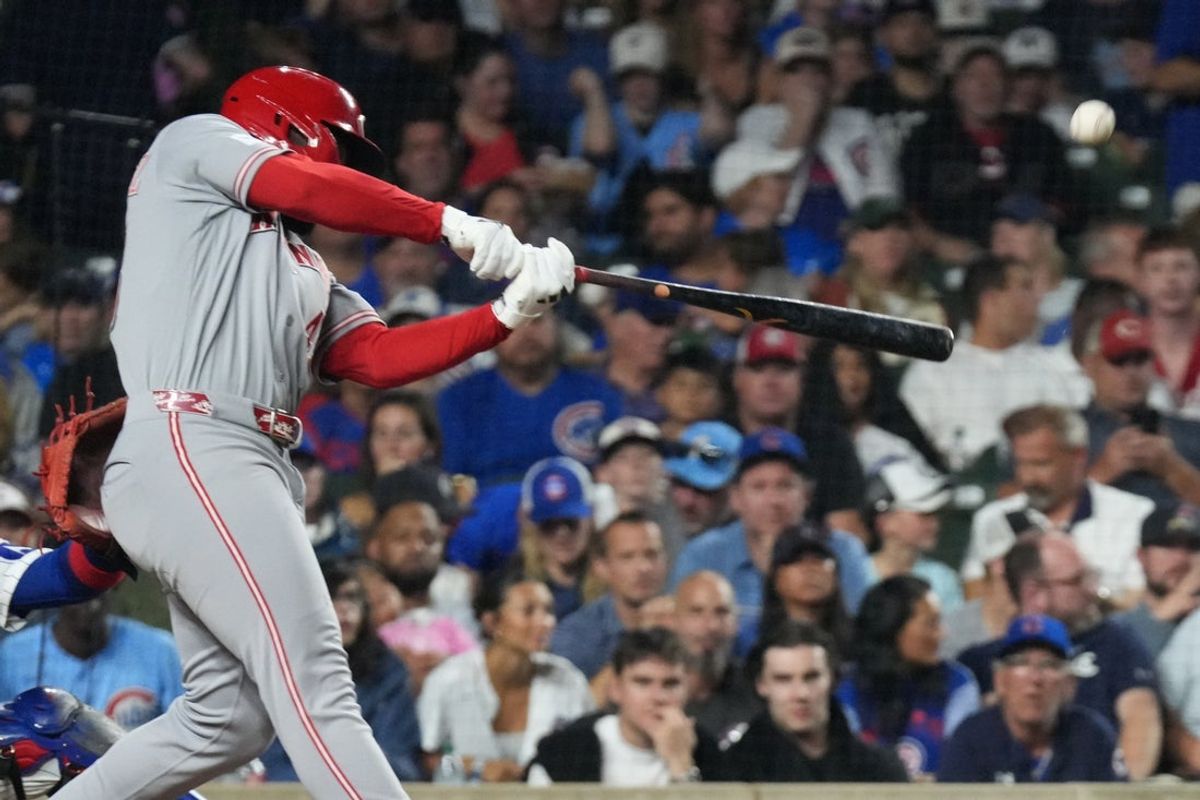 Aug 30, 2026; Chicago, Illinois, USA;  Cincinnati Reds right fielder Hector Rodriguez (43) hits a three-run home run against the Chicago Cubs during the fourth inning at Wrigley Field.  Mandatory Credit: David Banks-Imagn Images