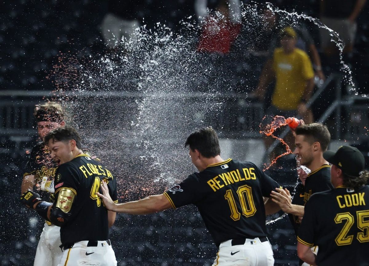 Sep 1, 2026; Pittsburgh, Pennsylvania, USA;  Pittsburgh Pirates catcher Rafael Flores Jr. (43) is doused with liquids after putting the ball in play and hustling to first base forcing a San Francisco Giants error to win the game during the ninth inning at PNC Park.  Mandatory Credit: Charles LeClaire-Imagn Images