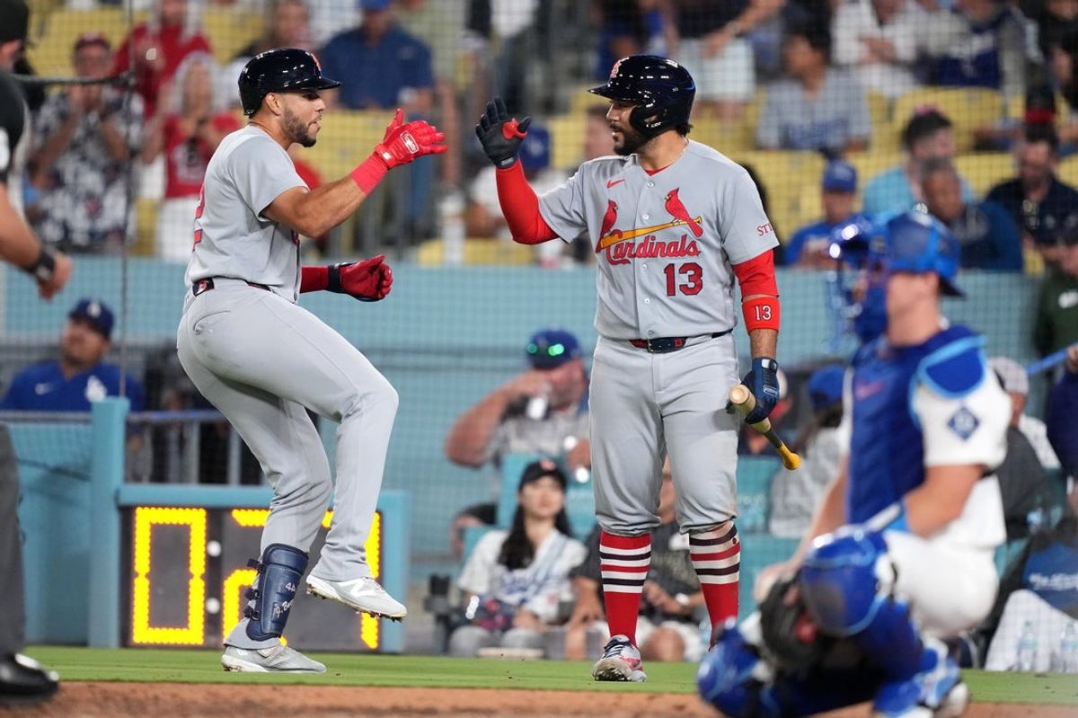 Sep 1, 2026; Los Angeles, California, USA;  St. Louis Cardinals outfielder Joshua Baez (22) celebrates with St. Louis Cardinals catcher Leonardo Bernal (13) after hitting a home run during the seventh inning against the Los Angeles Dodgers at Dodger Stadium.  Mandatory Credit: Kirby Lee-Imagn Images