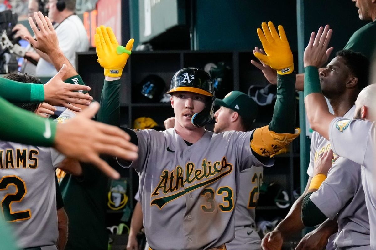 Sep 2, 2026; Arlington, Texas, USA;  Athletics center fielder Henry Bolte (33) is greeted in the dugout by teammates after hitting his second two-run home run of the game against the Texas Rangers during the fourth inning at Globe Life Field. Mandatory Credit: Raymond Carlin III-Imagn Images