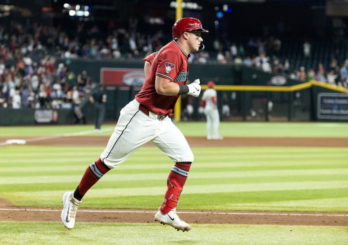 Sep 2, 2026; Phoenix, Arizona, USA; Arizona Diamondbacks catcher James McCann rounds the bases after hitting a solo home run in the eighth inning against the Philadelphia Phillies at Chase Field. Mandatory Credit: Mark J. Rebilas-Imagn Images