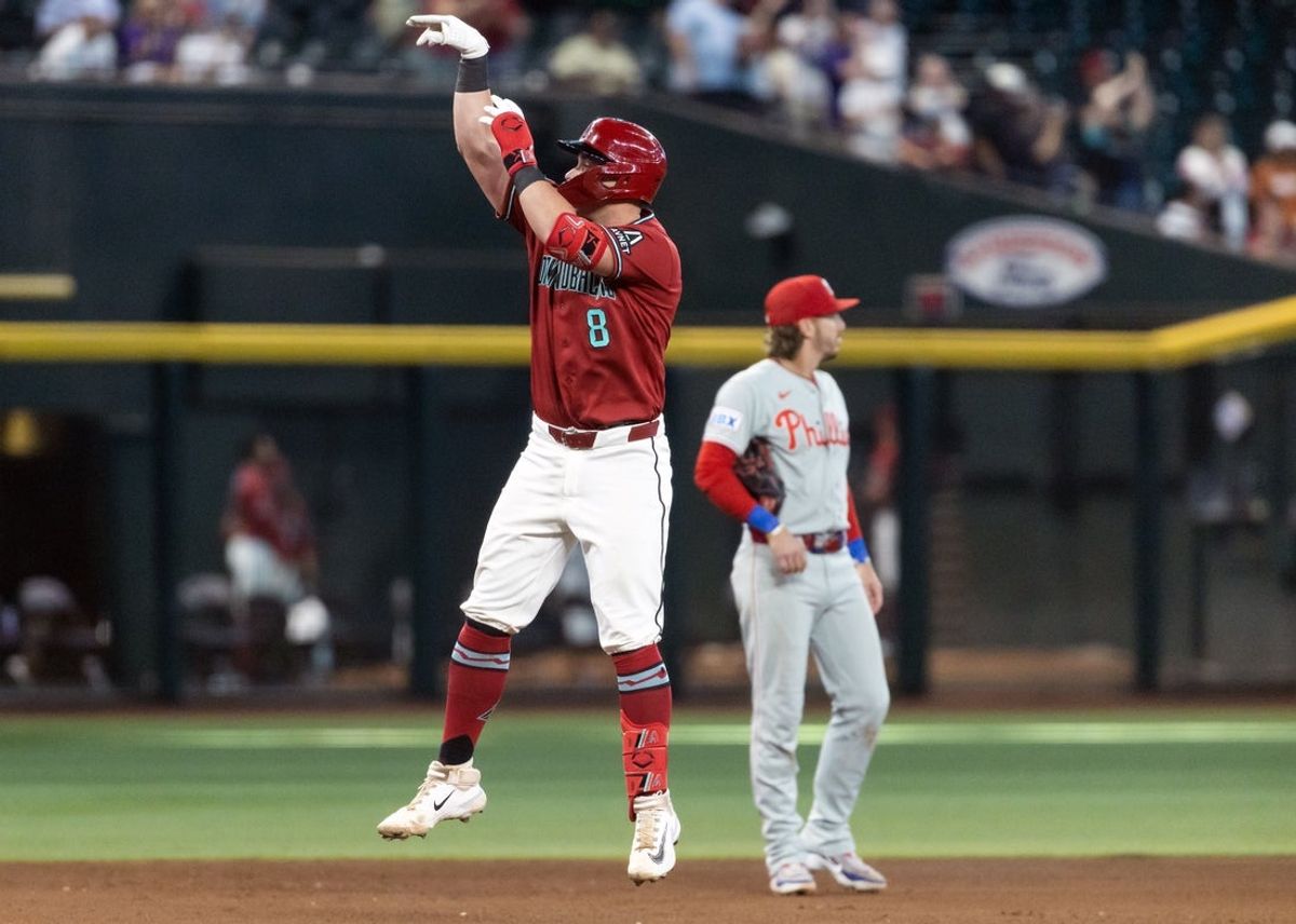 Sep 2, 2026; Phoenix, Arizona, USA; Arizona Diamondbacks catcher James McCann celebrates as he rounds the bases after hitting a solo home run in the eighth inning against the Philadelphia Phillies at Chase Field. Mandatory Credit: Mark J. Rebilas-Imagn Images