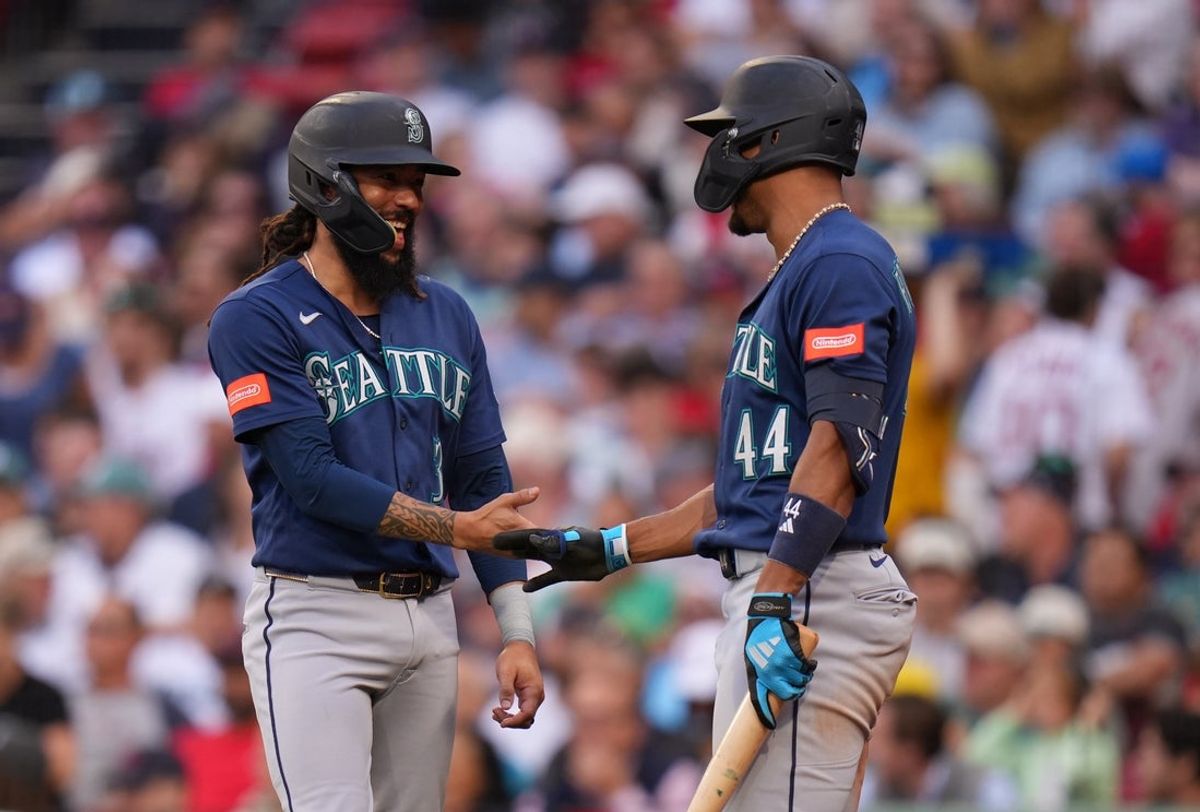 Sep 2, 2026; Boston, Massachusetts, USA; Seattle Mariners shortstop J.P. Crawford (3) is congratulated by center fielder Julio Rodríguez (44) after scoring against the Boston Red Sox in the sixth inning at Fenway Park. Mandatory Credit: David Butler II-Imagn Images