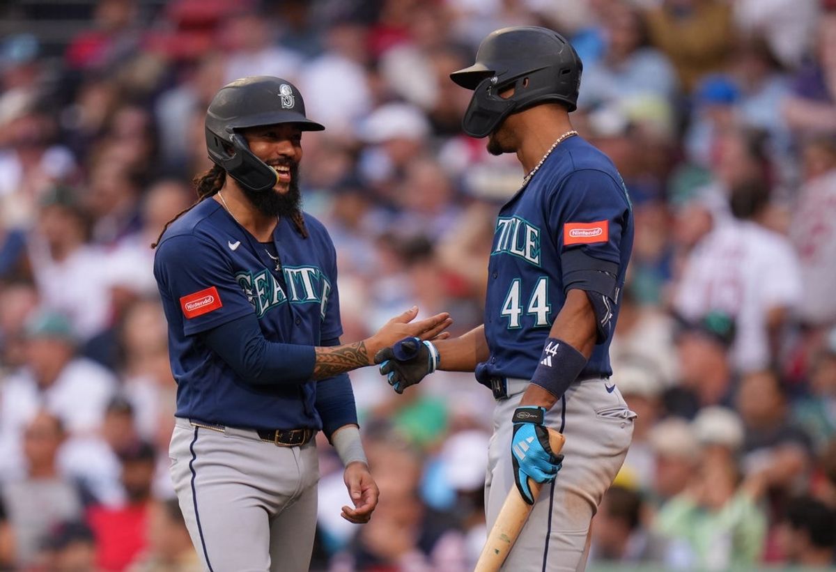 Sep 2, 2026; Boston, Massachusetts, USA; Seattle Mariners shortstop J.P. Crawford (3) is congratulated by center fielder Julio Rodríguez (44) after scoring against the Boston Red Sox in the sixth inning at Fenway Park. Mandatory Credit: David Butler II-Imagn Images