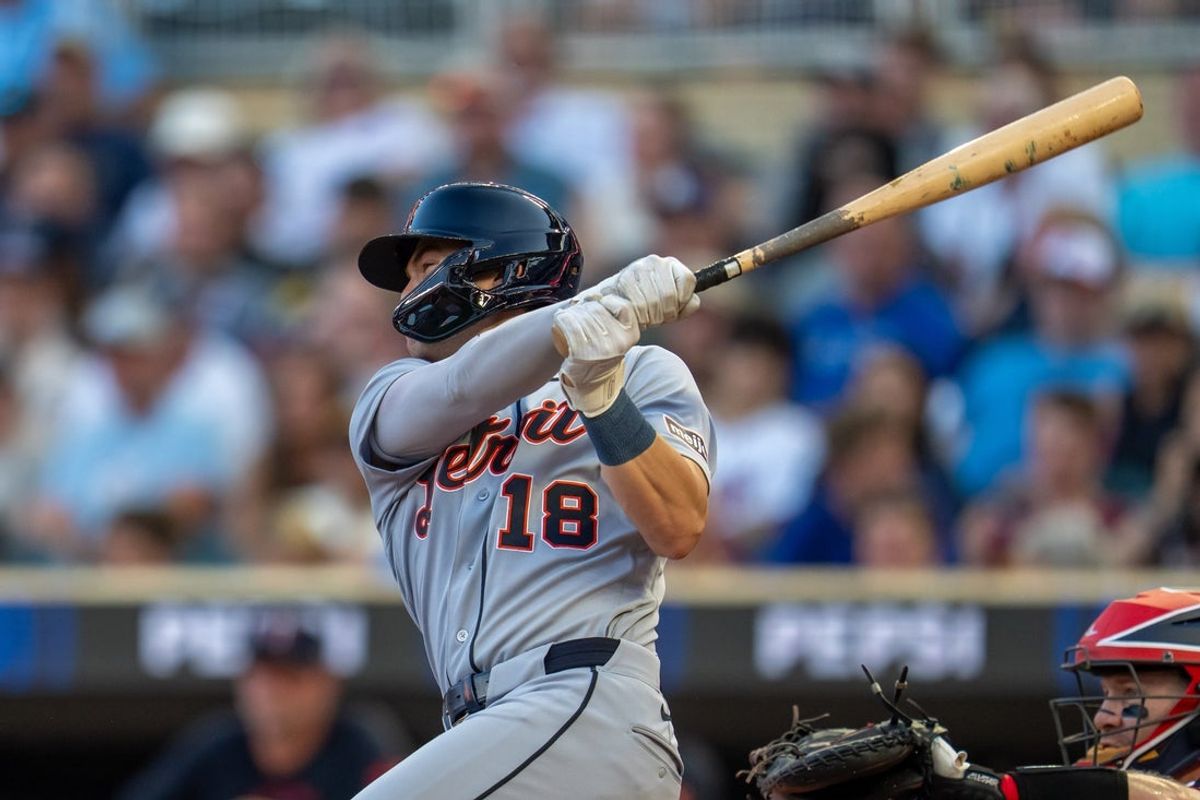 Sep 2, 2026; Minneapolis, Minnesota, USA;  Detroit Tigers shortstop John Peck (18) hits a RBI double against the Minnesota Twins in the second inning at Target Field.  Mandatory Credit: Jesse Johnson-Imagn Images