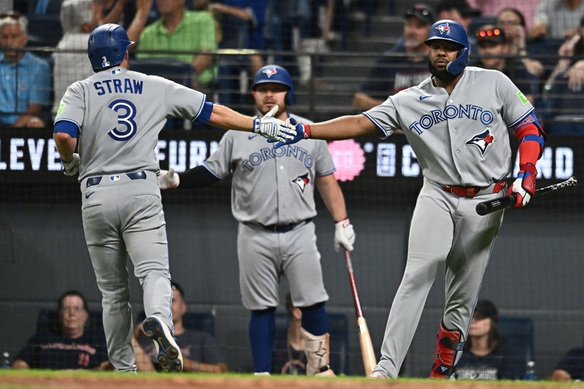 Sep 2, 2026; Cleveland, Ohio, USA; Toronto Blue Jays left fielder Myles Straw (3) celebrates with first baseman Vladimir Guerrero Jr. (27) after scoring during the sixth inning against the Cleveland Guardians at Progressive Field. Mandatory Credit: Ken Blaze-Imagn Images