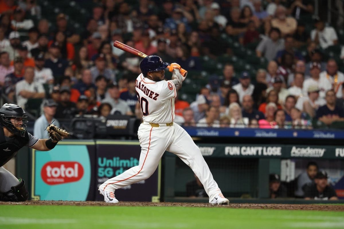 Sep 2, 2026; Houston, Texas, USA;  Houston Astros outfielder Nelson Velazquez (30) hits a single during the eighth inning against the Chicago White Sox at Daikin Park.  Mandatory Credit: Troy Taormina-Imagn Images