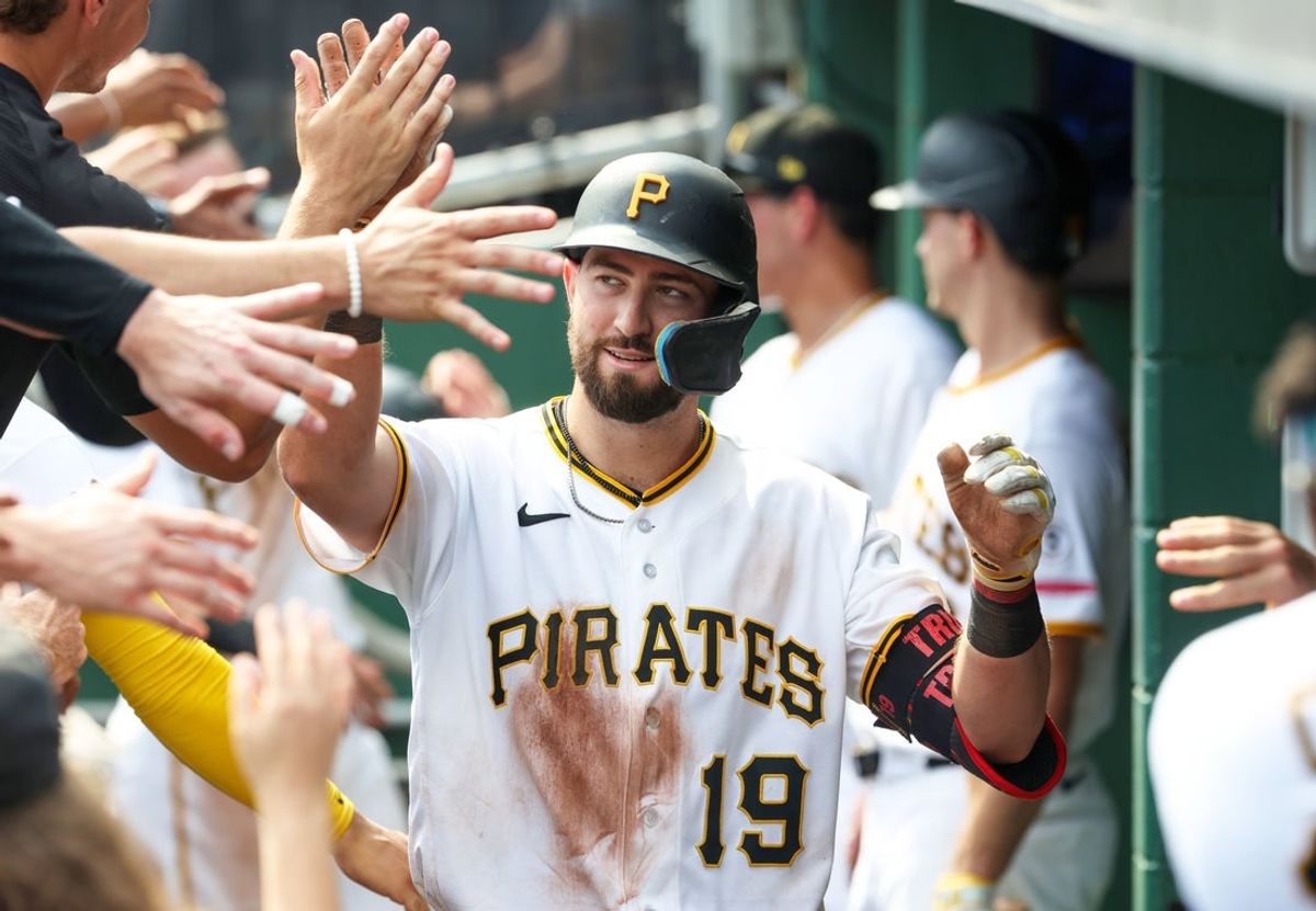 Sep 3, 2026; Pittsburgh, Pennsylvania, USA;  Pittsburgh Pirates shortstop Jared Triolo (19) celebrates in the dugout after driving in a run against the San Francisco Giants during the eighth inning at PNC Park.  Mandatory Credit: Charles LeClaire-Imagn Images