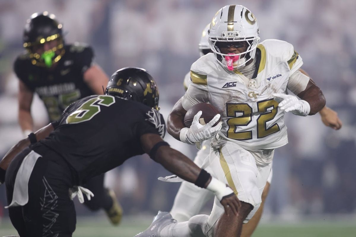 Sep 3, 2026; Atlanta, Georgia, USA;  Georgia Tech Yellow Jackets running back Justice Haynes (22) rushes the ball against Colorado Buffaloes defensive back Boo Carter (6) at Bobby Dodd Stadium at Hyundai Field.  Mandatory Credit: Brett Davis-Imagn Images