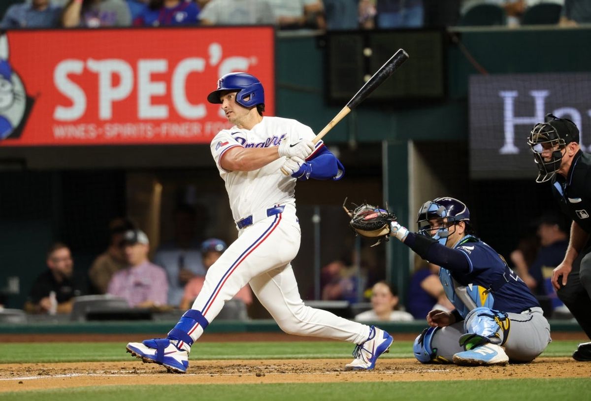 Sep 3, 2026; Arlington, Texas, USA; Texas Rangers second baseman Justin Foscue (14) hits an rbi single during the fourth inning against the Tampa Bay Rays at Globe Life Field. Mandatory Credit: Kevin Jairaj-Imagn Images