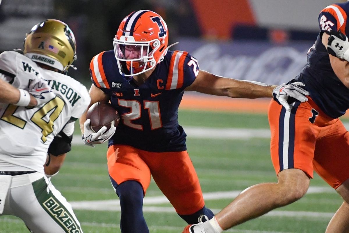 Sep 3, 2026; Champaign, Illinois, USA;  Illinois Fighting Illini running back Aidan Laughery (21) runs the ball during the first half against the UAB Blazers at Gies Memorial Stadium.  Mandatory Credit: Ron Johnson-Imagn Images