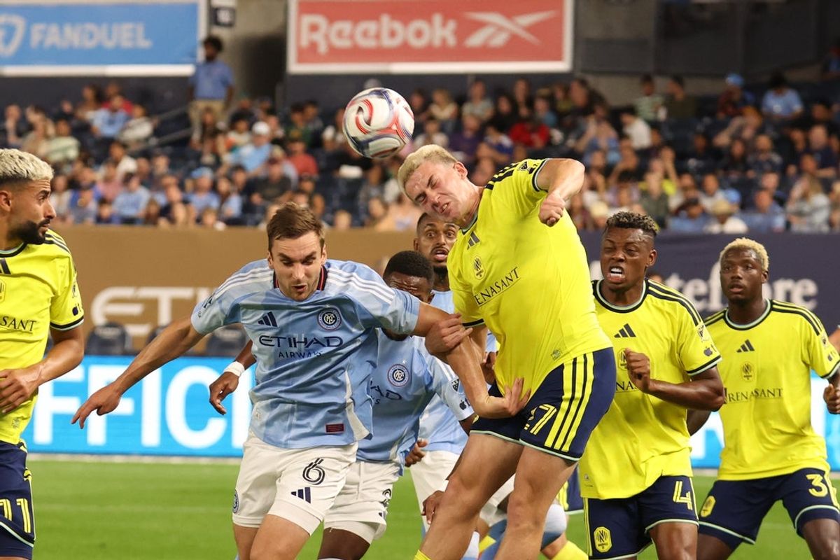 Sep 4, 2026; New York, New York, USA;  Nashville SC defender Reed Baker-Whiting (27) heads the ball away after a corner kick by New York City at Yankee Stadium.  Mandatory Credit: Thomas Salus-Imagn Images