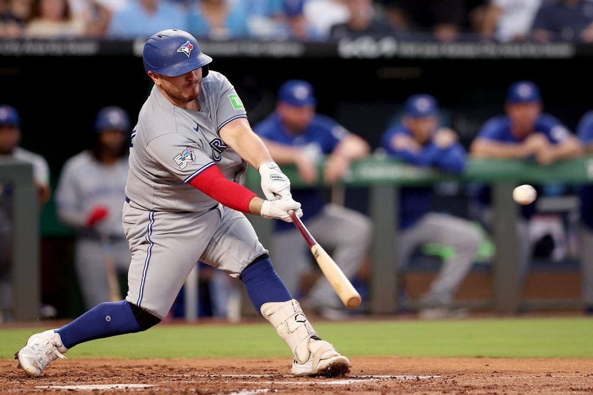Sep 4, 2026; Kansas City, Missouri, USA;  Toronto Blue Jays catcher Alejandro Kirk (30) hits an RBI double during the second inning against the Kansas City Royals at Kauffman Stadium.  Mandatory Credit: William Purnell-Imagn Images