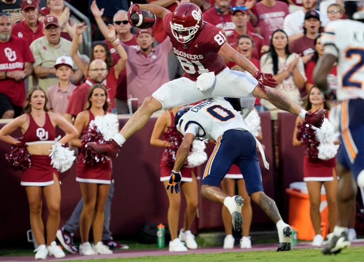 Oklahoma's Rocky Beers (81) leaps over UTEP's Justin Content (0) as he runs in for a touchdown after a catch in the first half of the college football game between the University of Oklahoma Sooners and the UTEP Miners at the Gaylord Family - Oklahoma Memorial Stadium in Norman, Okla., Sept. 4, 2026.