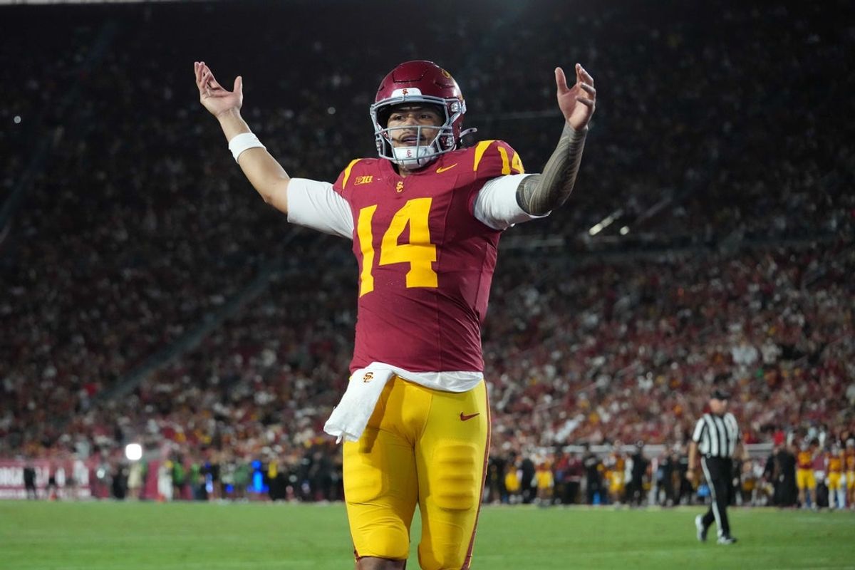Sep 4, 2026; Los Angeles, California, USA; Southern California Trojans quarterback Jayden Maiava (14) celebrates after a touchdown against the Fresno State Bulldogs in the first half at United Airlines Field at Los Angeles Memorial Coliseum. Mandatory Credit: Kirby Lee-Imagn Images