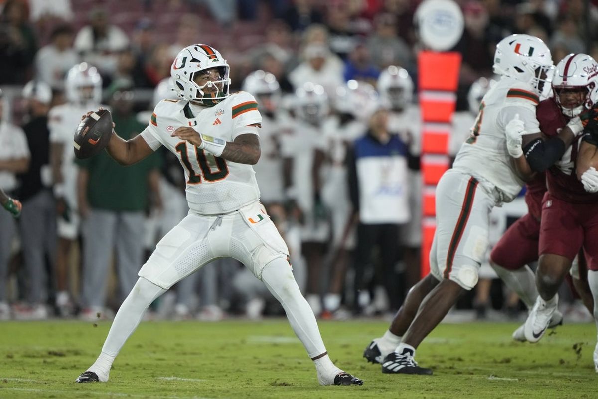 Sep 4, 2026; Stanford, California, USA;  Miami Hurricanes quarterback Darian Mensah (10) throws downfield against the Stanford Cardinal during the third quarter at Stanford Stadium.  Mandatory Credit: Stan Szeto-Imagn Images