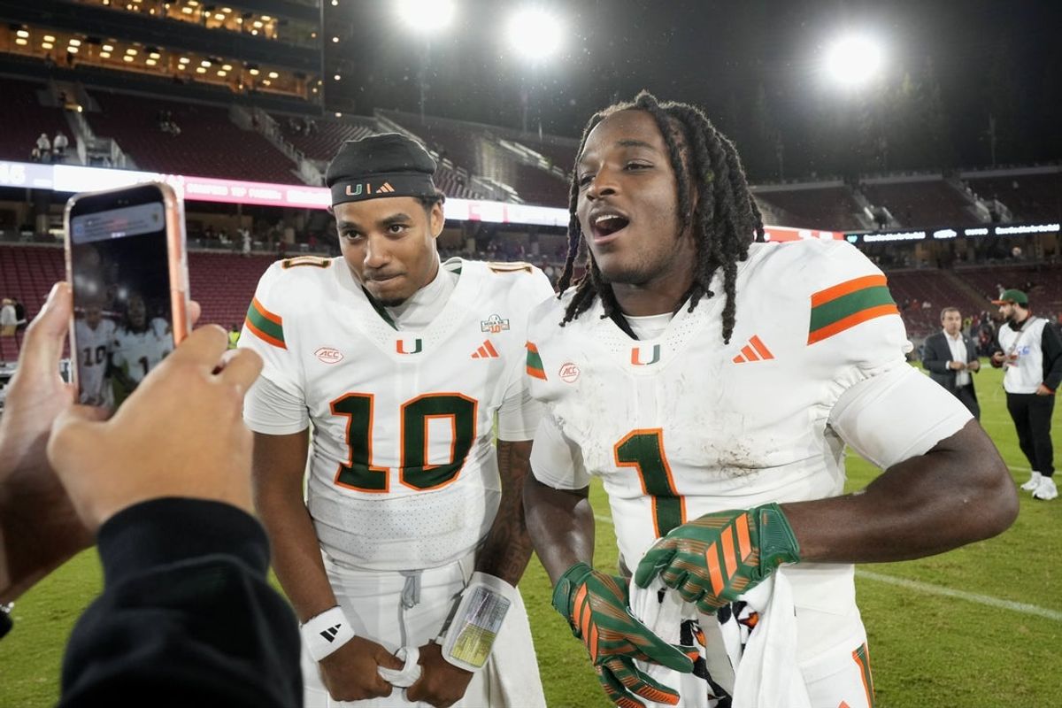 Sep 4, 2026; Stanford, California, USA;  Miami Hurricanes quarterback Darian Mensah (10) and wide receiver Malachi Toney (1) on the field after defeating the Stanford Cardinal at Stanford Stadium.  Mandatory Credit: Stan Szeto-Imagn Images