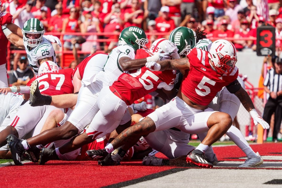 Sep 5, 2026; Lincoln, Nebraska, USA;  Nebraska Cornhuskers running back Jamal Rule (25) drives in for a touchdown against the Ohio Bobcats during the first quarter at Memorial Stadium.  Mandatory Credit: Dylan Widger-Imagn Images