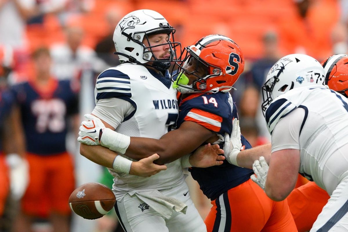 Sep 5, 2026; Syracuse, New York, USA;  Syracuse Orange linebacker Keyshawn Johnson (14) sacks New Hampshire Wildcats quarterback Brooks Bentley (7) causing a fumble during the first half at the JMA Wireless Dome.  Mandatory Credit: Rich Barnes-Imagn Images