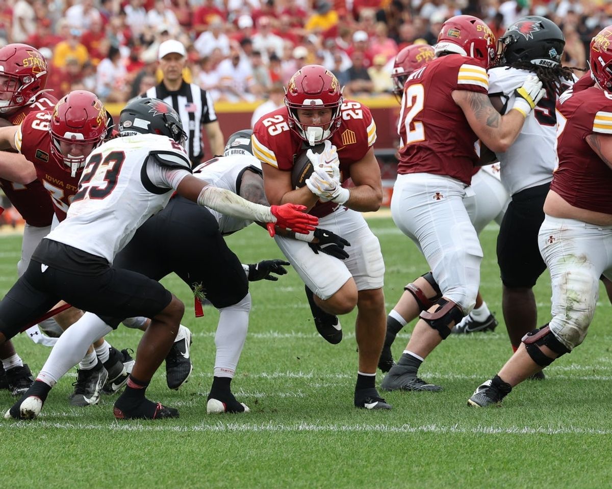 Sep 5, 2026; Ames, Iowa, USA; Southeast Missouri State Redhawks safety DJ Delmore (23) looks to tackles Iowa State Cyclones running back Easton Miller (25) at Jack Trice Stadium. Mandatory Credit: Reese Strickland-Imagn Images