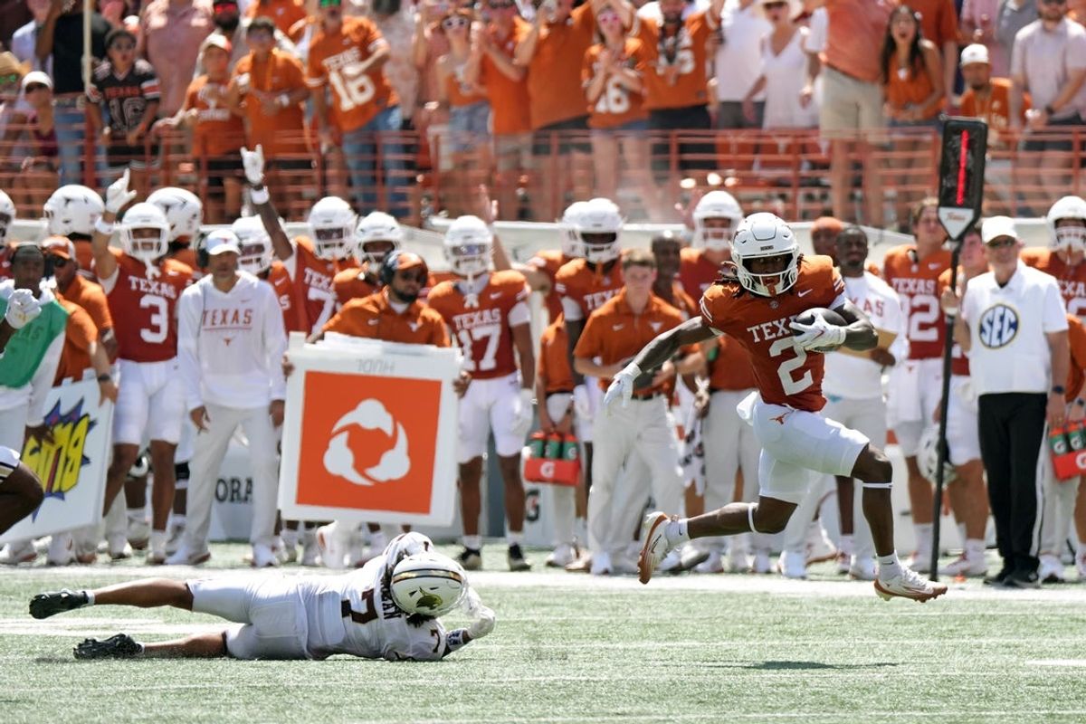 Sep 5, 2026; Austin, Texas, USA;  Texas Longhorns running back Hollywood Smothers (2) runs past  Texas State Bobcats defensive back Ryan Nolan (7) for forty-five yards during the first quarter at Darrell K Royal-Texas Memorial Stadium.  Mandatory Credit: Scott Wachter-Imagn Images