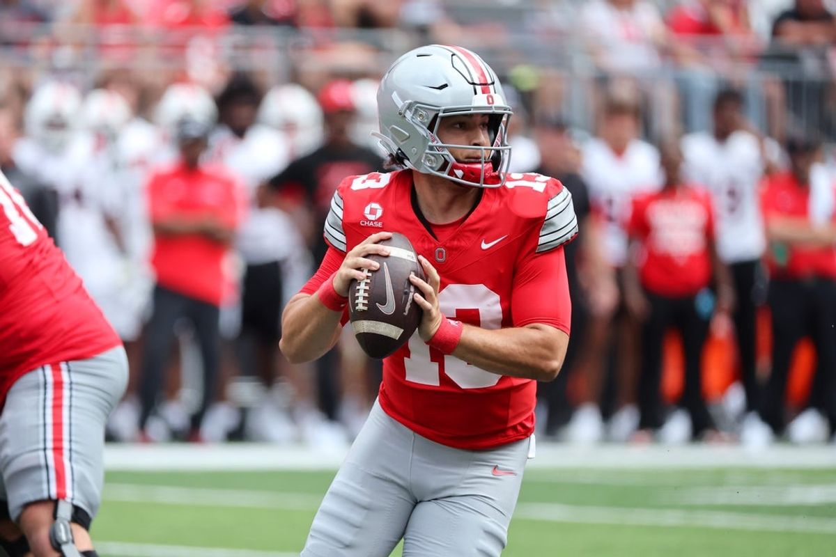 Ohio State Buckeyes quarterback Luke Fahey (13) drops back to throw during the fourth quarter against the Ball State Cardinals at Ohio Stadium.