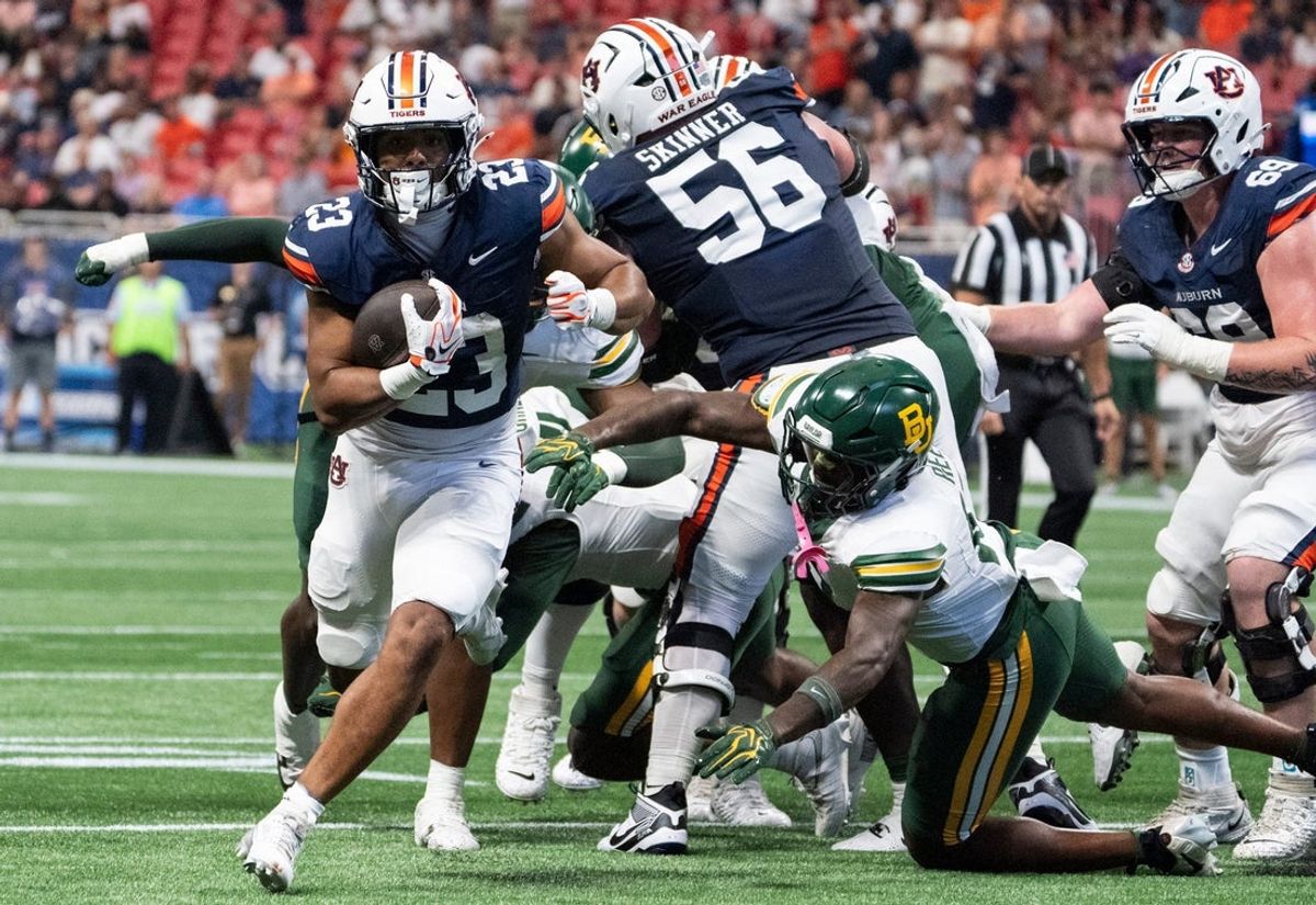 Auburn Tigers running back Jeremiah Cobb (23) breaks free for a rushing touchdown as Auburn Tigers take on Baylor Bears in the Aflac Kickoff Game at Mercedes-Benz Stadium in Atlanta, Ga. on Saturday, Sept. 5, 2026. Auburn Tigers lead Baylor Bears 10-7 at halftime.