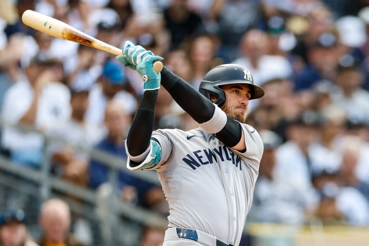 Sep 5, 2026; San Diego, California, USA;  New York Yankees left fielder Cody Bellinger (35) hits a two-run single during the second inning against the San Diego Padres at Petco Park.  Mandatory Credit: David Frerker-Imagn Images
