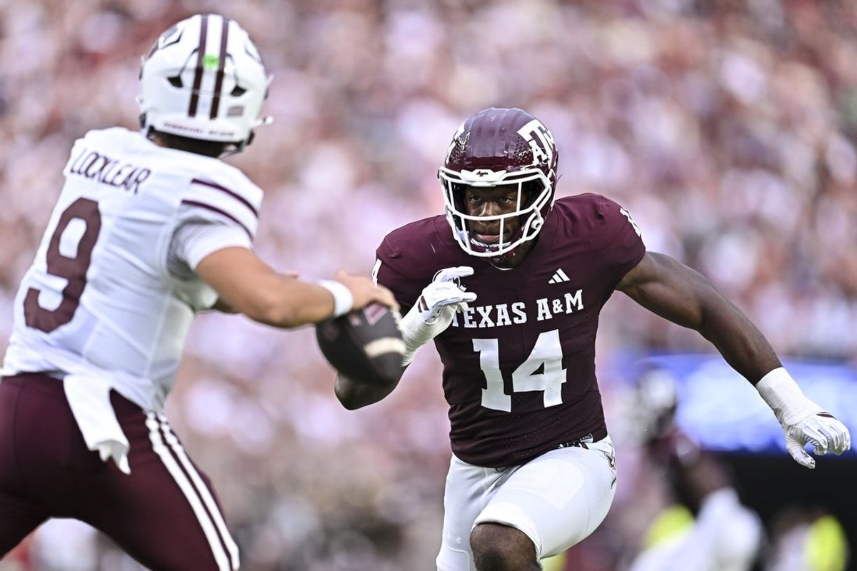 Sep 5, 2026; College Station, Texas, USA; Texas A&M Aggies defensive end Anto Saka (14) applies pressure to Missouri State Bears quarterback Skyler Locklear (9) during the first quarter at Kyle Field. Mandatory Credit: Maria Lysaker-Imagn Images