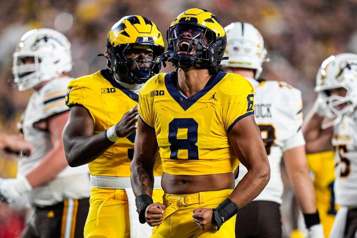 Michigan defensive end Dom Nichols (8), center, celebrates sack of Western Michigan quarterback Broc Lowry (not in the photo ) during the first half at Michigan Stadium in Ann Arbor on Saturday, Sept. 5, 2026.
