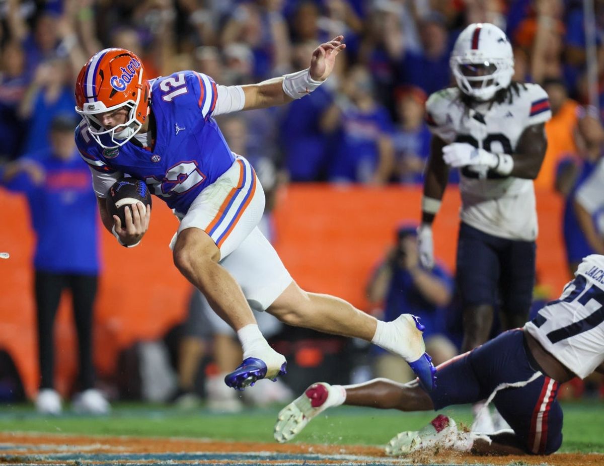 Florida quarterback Aaron Philo (12) scores during the first half an NCAA football game at Steve Spurrier Field at Ben Hill Griffin Stadium in Gainesville, FL on Saturday, September 5, 2026. [Alan Youngblood/Gainesville Sun]