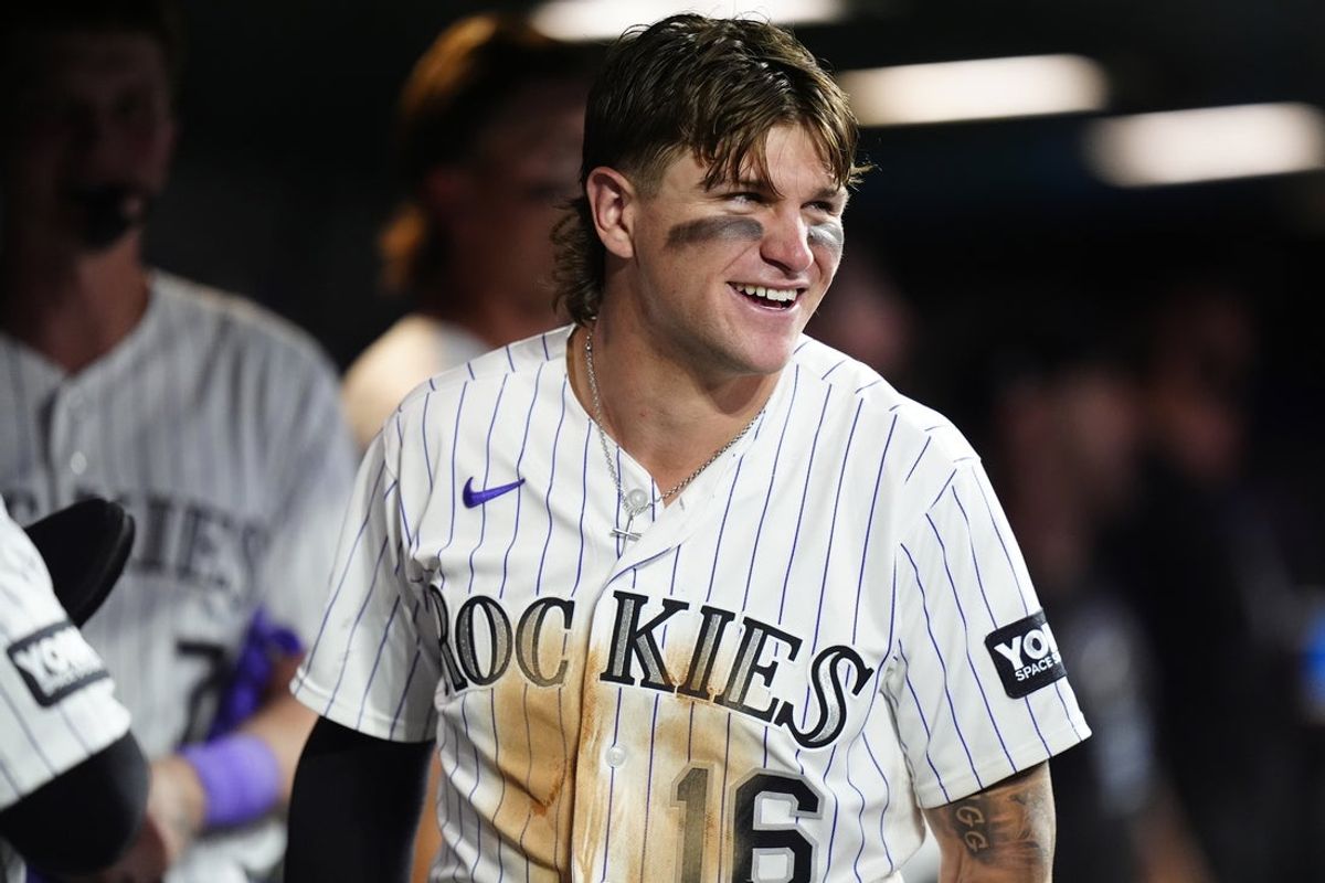 Sep 5, 2026; Denver, Colorado, USA;  Colorado Rockies center fielder Cole Carrigg (16) celebrates scoring a run in the seventh inning against the St. Louis Cardinals at Coors Field.  Mandatory Credit: Ron Chenoy-Imagn Images