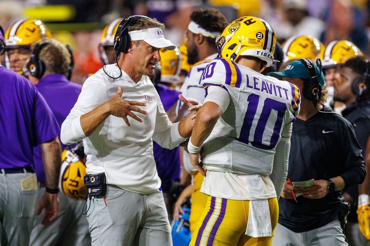 Sep 5, 2026; Baton Rouge, Louisiana, USA;  LSU Tigers head coach Lane Kiffin talks to quarterback Sam Leavitt (10) against Clemson Tigers during the first half at Tiger Stadium.  Mandatory Credit: Stephen Lew-Imagn Images