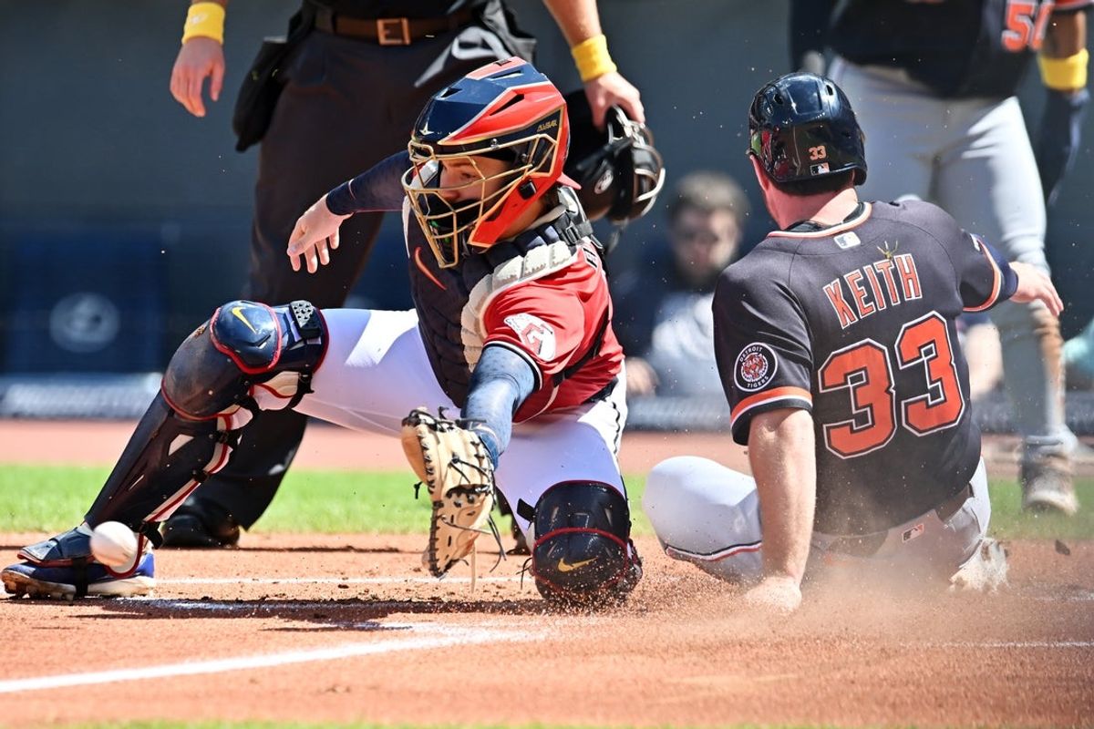 Sep 6, 2026; Cleveland, Ohio, USA; Detroit Tigers first baseman Colt Keith (33) scores as Cleveland Guardians catcher Patrick Bailey (16) waits for the throw during the first inning at Progressive Field. Mandatory Credit: Ken Blaze-Imagn Images