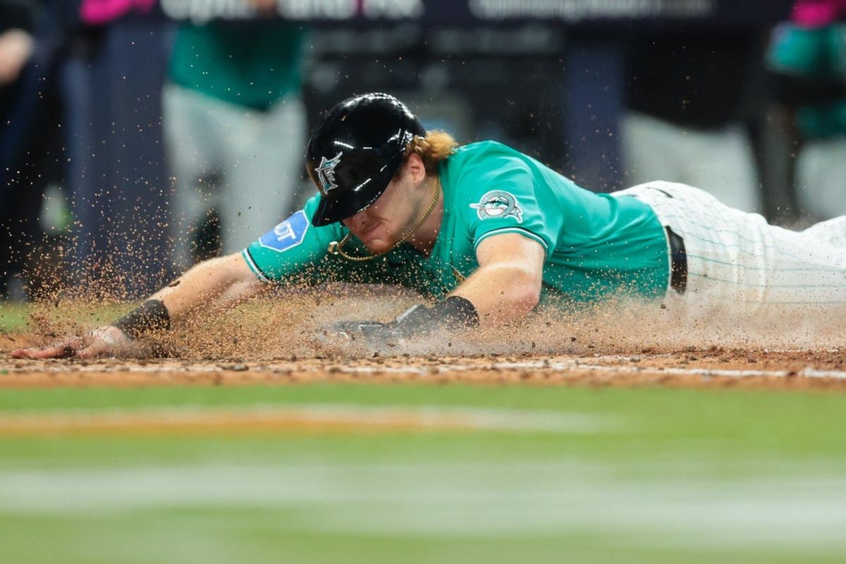 Sep 6, 2026; Miami, Florida, USA; Miami Marlins right fielder Owen Caissie (17) scores against the Chicago Cubs during the fifth inning at loanDepot Park. Mandatory Credit: Sam Navarro-Imagn Images