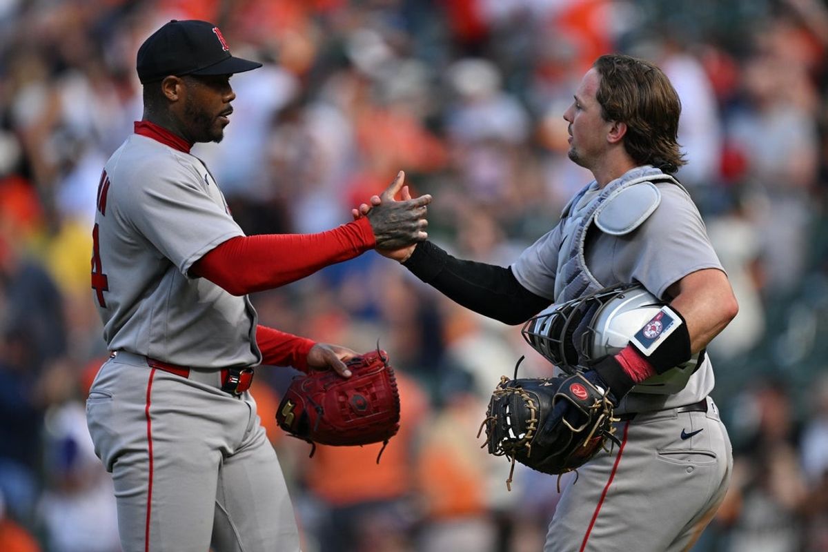 Sep 6, 2026; Baltimore, Maryland, USA;  Boston Red Sox pitcher Aroldis Chapman (44) celebrates with catcher Adley Rutschman (31) after defeating the Baltimore Orioles at Oriole Park at Camden Yards. Mandatory Credit: Jamie Sabau-Imagn Images