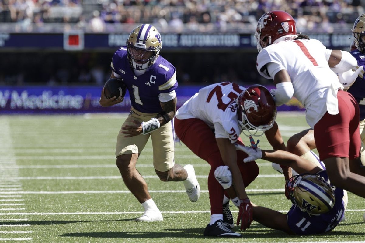 Sep 6, 2026; Seattle, Washington, USA;  Washington Huskies quarterback Demond Williams Jr. (1) carries the ball for a touchdown against the Washington State Cougars during the second quarter at Husky Stadium.  Mandatory Credit: Joe Nicholson-Imagn Images
