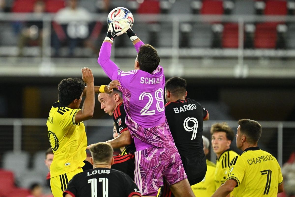 Sep 9, 2026; Washington, District of Columbia, USA;  Columbus Crew goalkeeper Patrick Schulte (28) punches the ball away on a DC United corner kick in the second half at Audi Field. Mandatory Credit: Jamie Sabau-Imagn Images