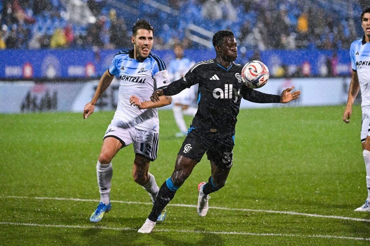 Sep 9, 2026; Montreal, Province of Quebec, CAN;  Charlotte FC forward Rodolfo Aloko (37) plays the ball against CF Montreal defender Luca Petrasso (13) during the second half at Saputo Stadium.  Mandatory Credit: David Kirouac-Imagn Images