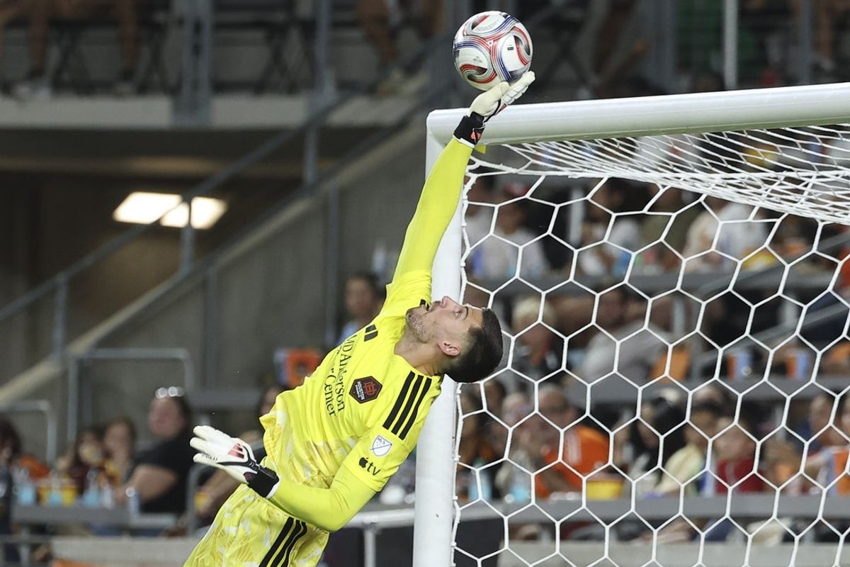 Sep 19, 2026; Houston, Texas, USA; Houston Dynamo FC goalkeeper Jonathan Bond (31) defends against a shot on goal during the first half against FC Cincinnati at Shell Energy Stadium. Mandatory Credit: Troy Taormina-Imagn Images