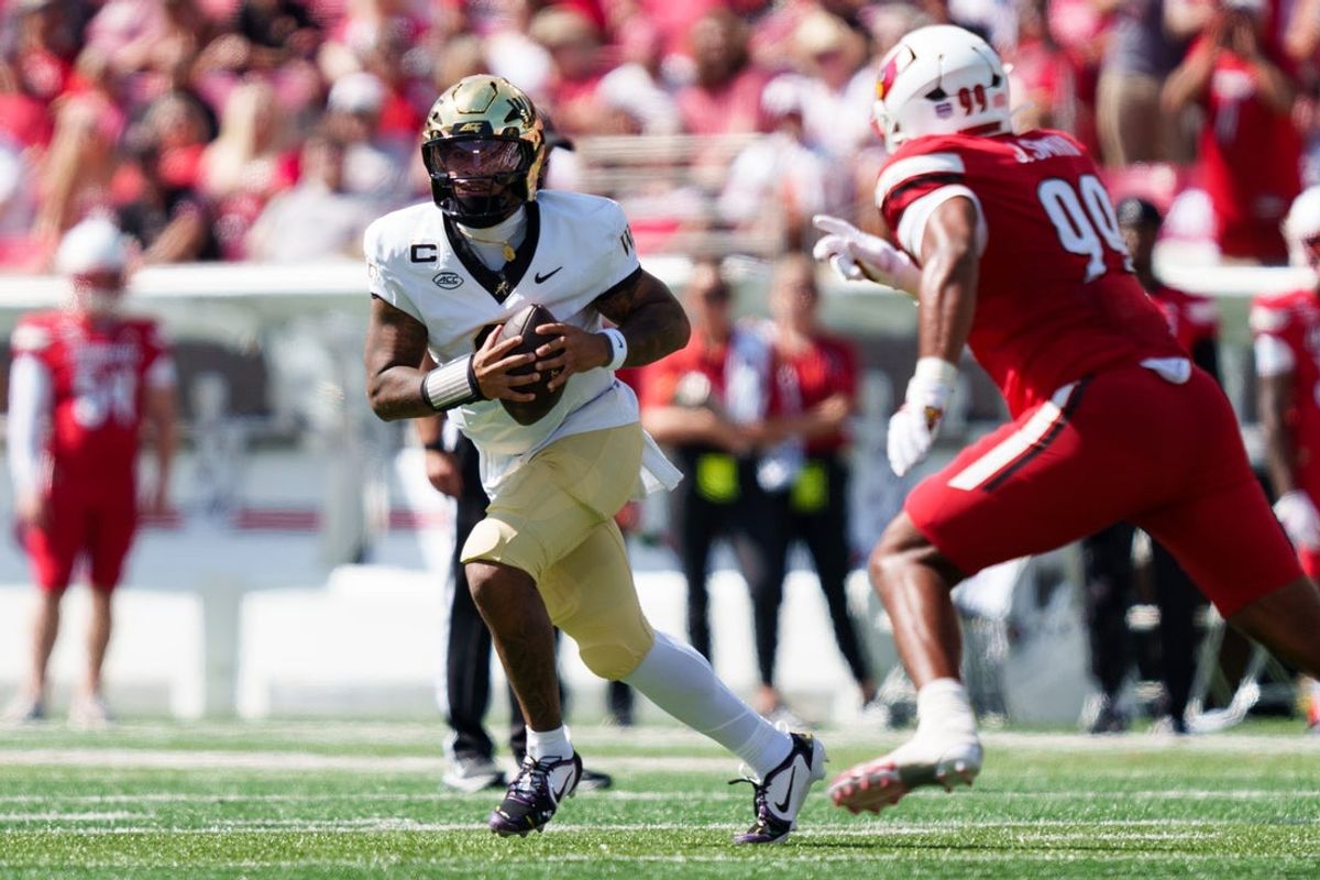 Sep 26, 2026; Louisville, Kentucky, USA;  Wake Forest Demon Deacons quarterback Gio Lopez (3) looks to pass against the Louisville Cardinals at L&N Federal Credit Union Stadium.  Mandatory Credit: Chris Carter-Imagn Images