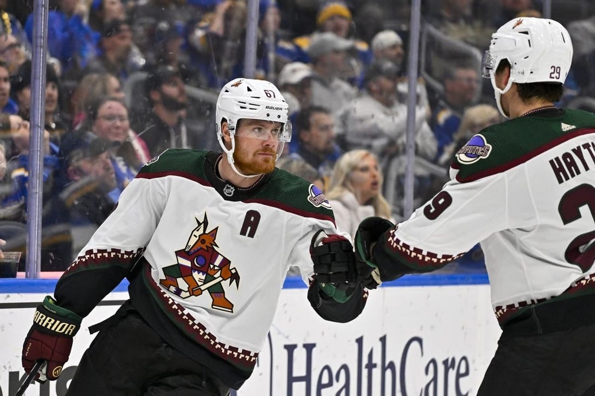 Nov 9, 2023; St. Louis, Missouri, USA;  Arizona Coyotes left wing Lawson Crouse (67) is congratulated by center Barrett Hayton (29) after scoring against the St. Louis Blues during the first period at Enterprise Center.