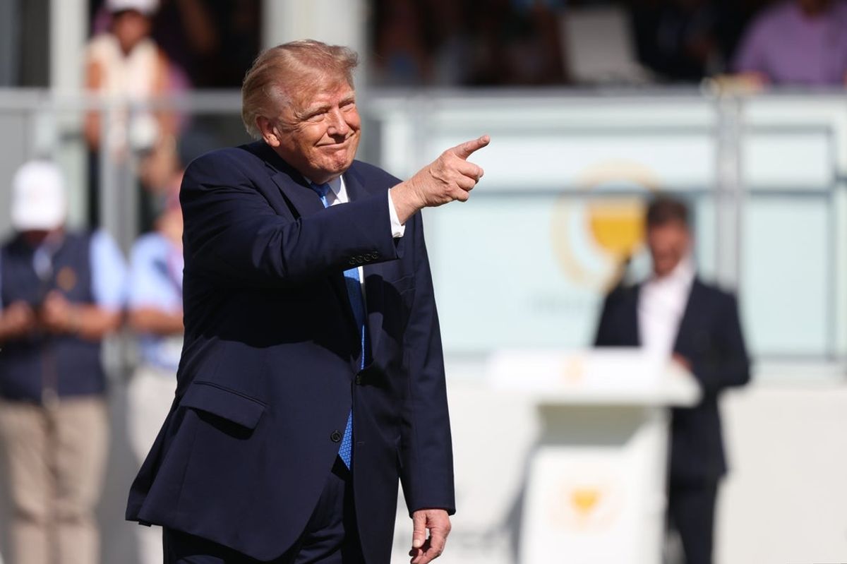 President Donald Trump acknowledges the gallery during the final round of the Presidents Cup.