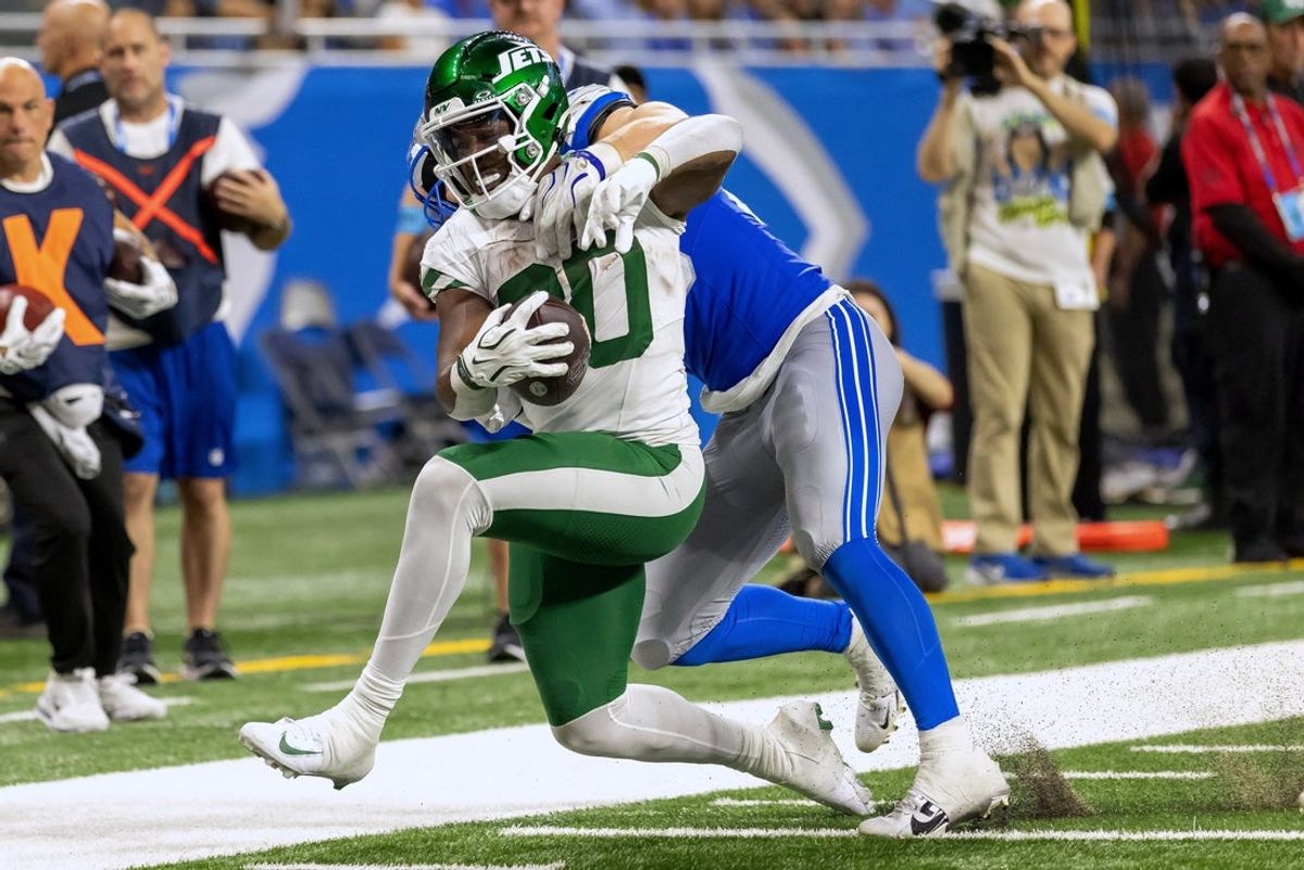 Sep 27, 2026; Detroit, Michigan, USA;  New York Jets running back Breece Hall (20) runs with the ball against the Detroit Lions during the fourth quarter at Ford Field.  Mandatory Credit: David Reginek-Imagn Images